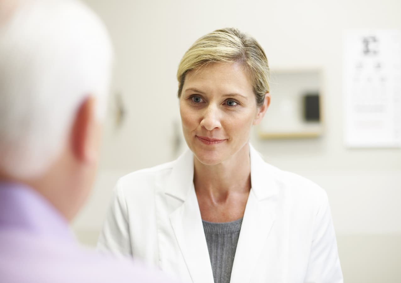 Physician attending to a patient