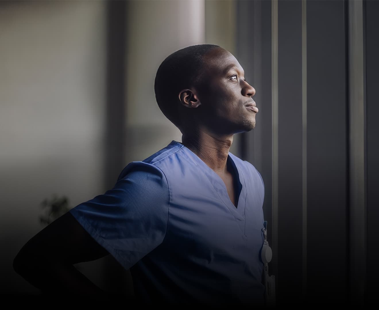 Clinician looking outside window