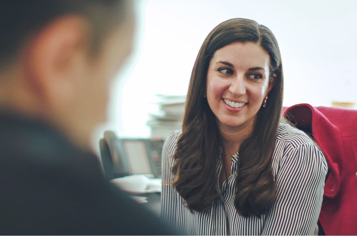 HMP Global team member working in office