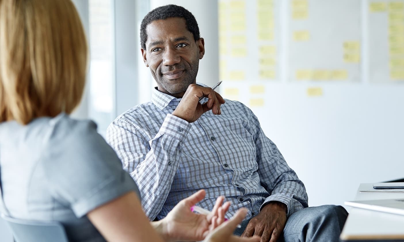 Business man speaking with coworker